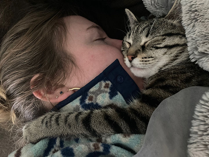 Sophie and her cat, Luna, sleeping